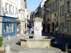 Square with a fountain in Senlis a charming city in Paris region