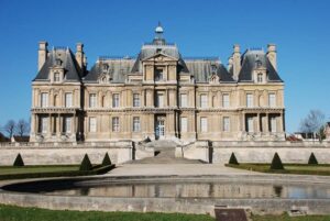 Castle de Maisons seen from the gardens beside the Seine river